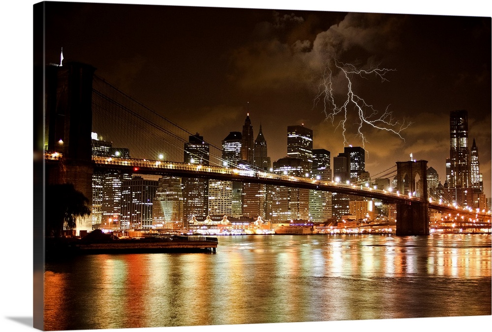 Night shot of the Brooklyn Bridge and Manhattan skyline at night under a bolts of lightning.
