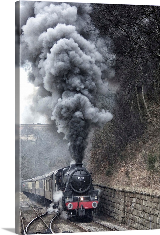 Lots of steam from a locomotive's smokestack.