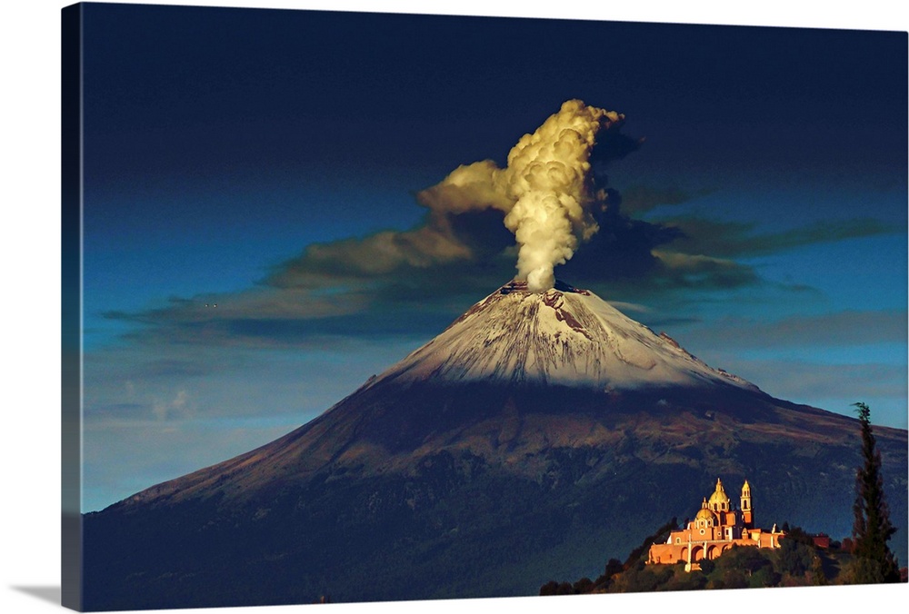 Smoking Popocatepetl volcano in Mexico in the dawn light.