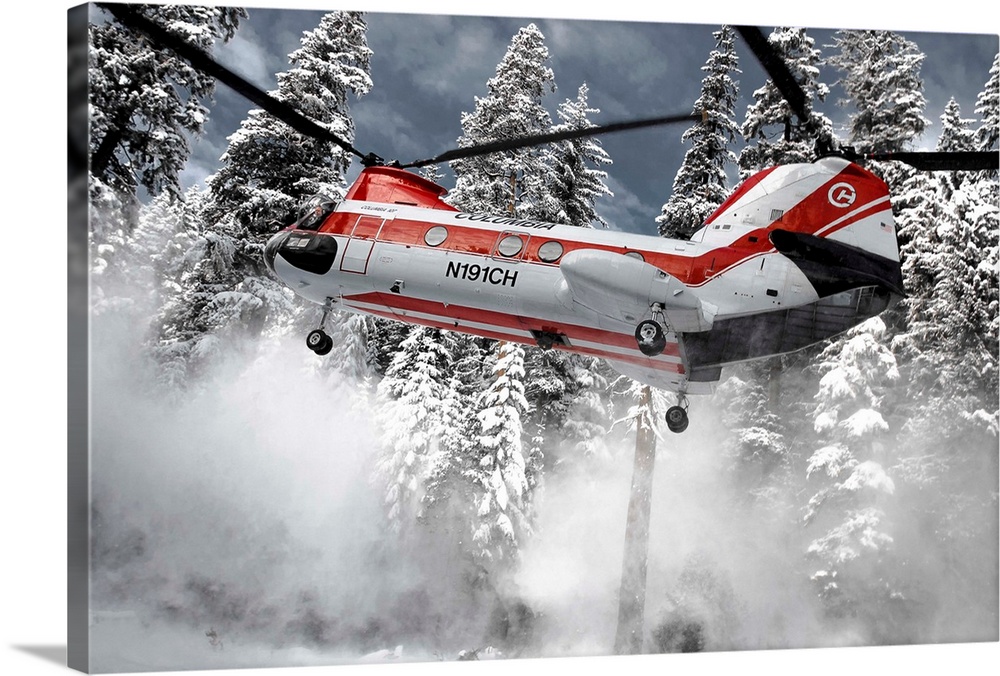 A helicopter lifts up off the ground, sending snow flying away.