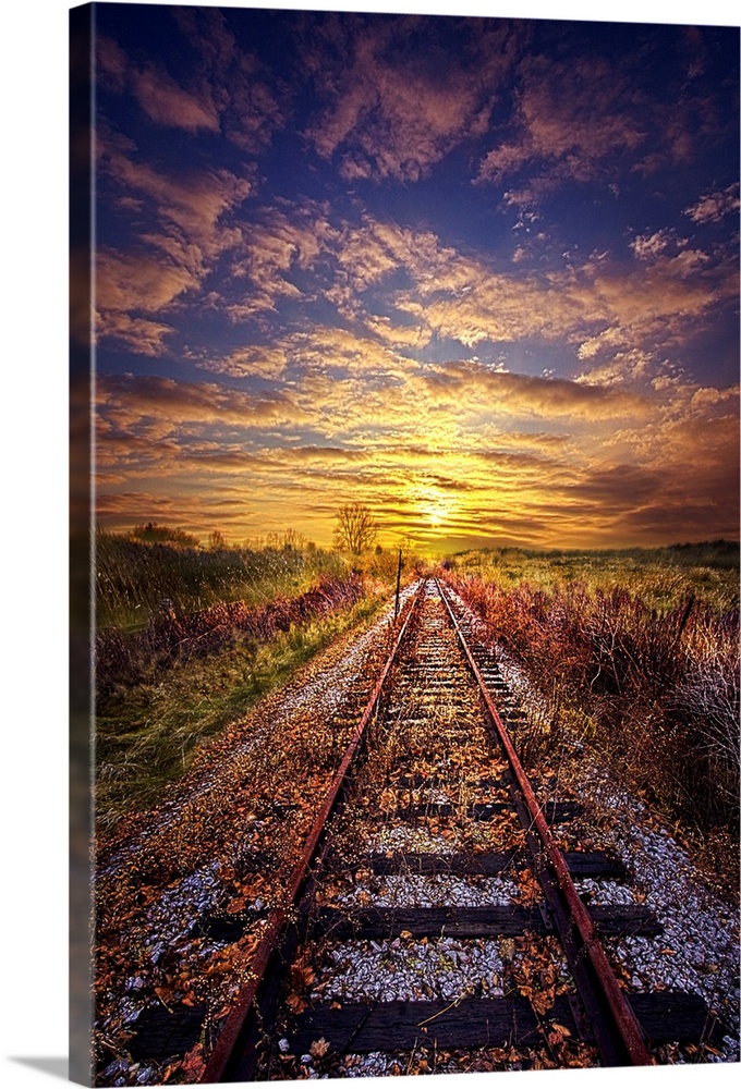 Railroad tracks leading to the horizon at sunset, Wisconsin.