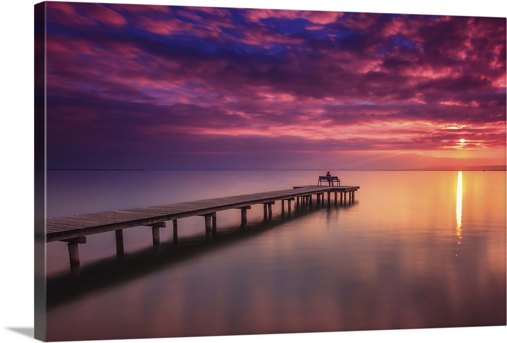 A pier in Lake Neusiedl at sunset, Austria.