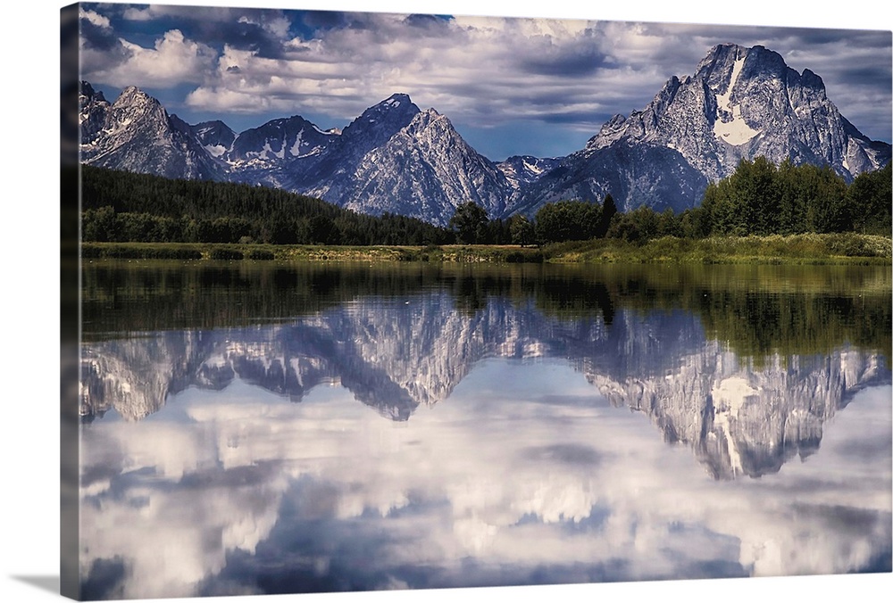 A mirror image of the Tetons reflecting on the Snake River at Oxbow Bend.