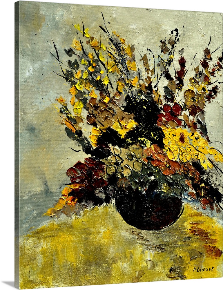A large bouquet of flowers in earth tone colors on a yellow table against of neutral backdrop.