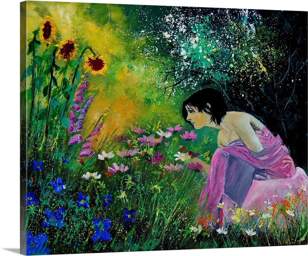 Horizontal portrait of a woman sitting in a garden full of blooming flowers in the spring.