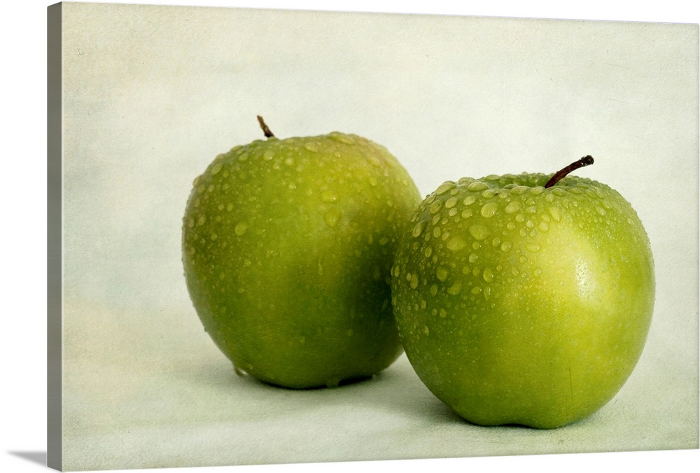 Two apples with water drops, taken with available light