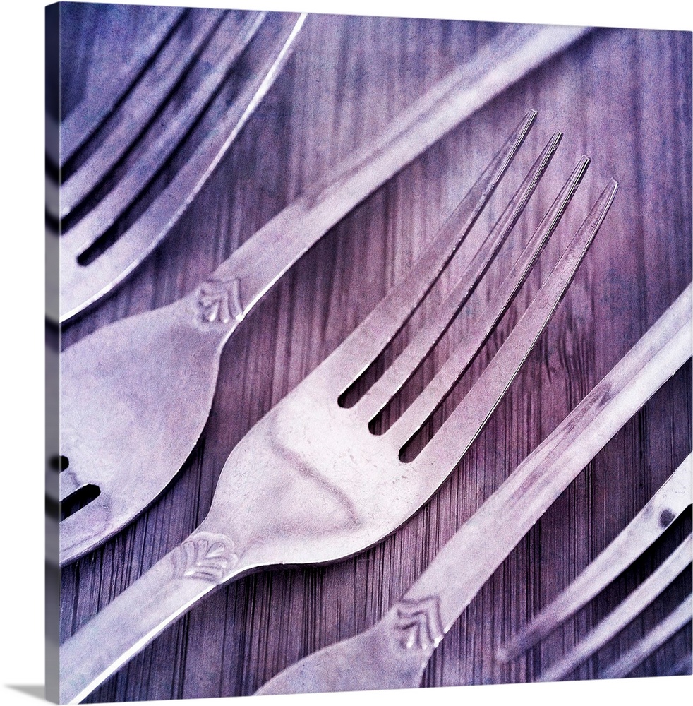 Forks, arranged on wood.