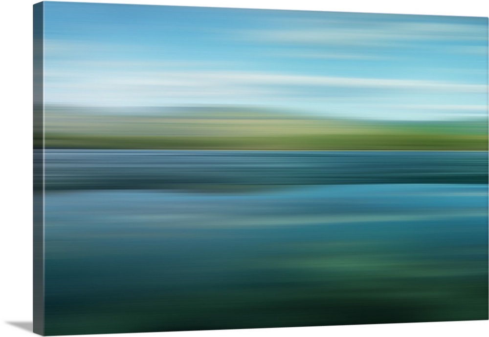 An artistic photograph of a horizontal blurred landscape of a green mountainscape.