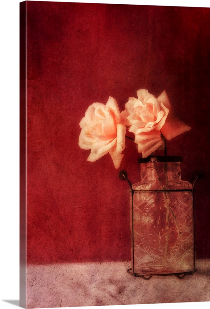 Still life with roses and an old vase against a rich dark red wall, natural light from the window.