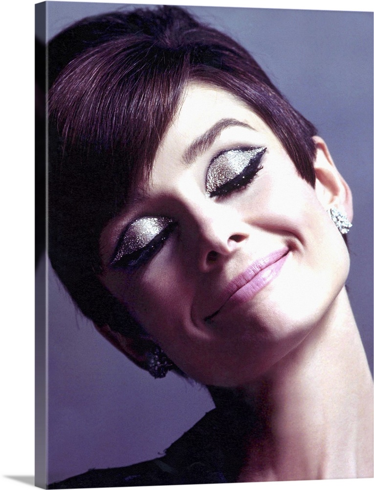 Canvas photo art of Audrey Hepburn with sparkling eye make up smiling.