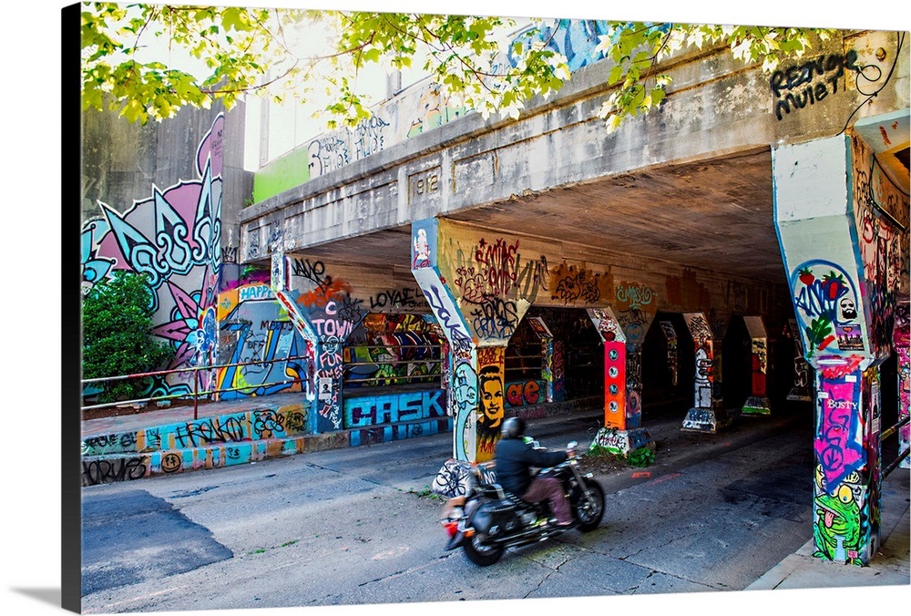 A motorcyclist enters the graffiticovered Krog Street Tunnel in