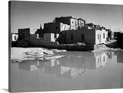 Acoma Pueblo, New Mexico, Full Side View Of Adobe House With Water In Foreground