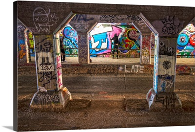 An artist paints the walls of the Krog Street Tunnel in Atlanta, Georgia