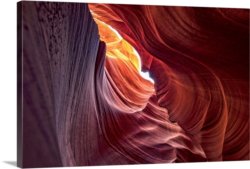 Photograph from inside of Antelope Canyon rock formation located on the Navajo Reservation in Page, Arizona with colorful ...
