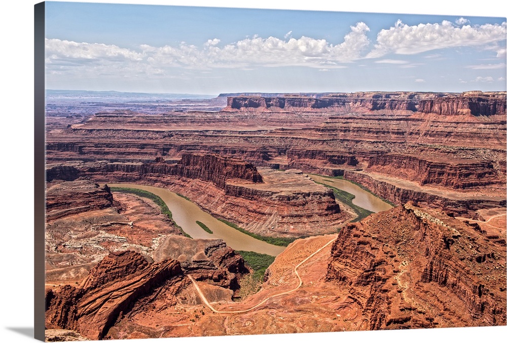 A tight bend in the Colorado River through the sandstone cliffs, seen from Dead Horse Point State Park, Moab, Utah.