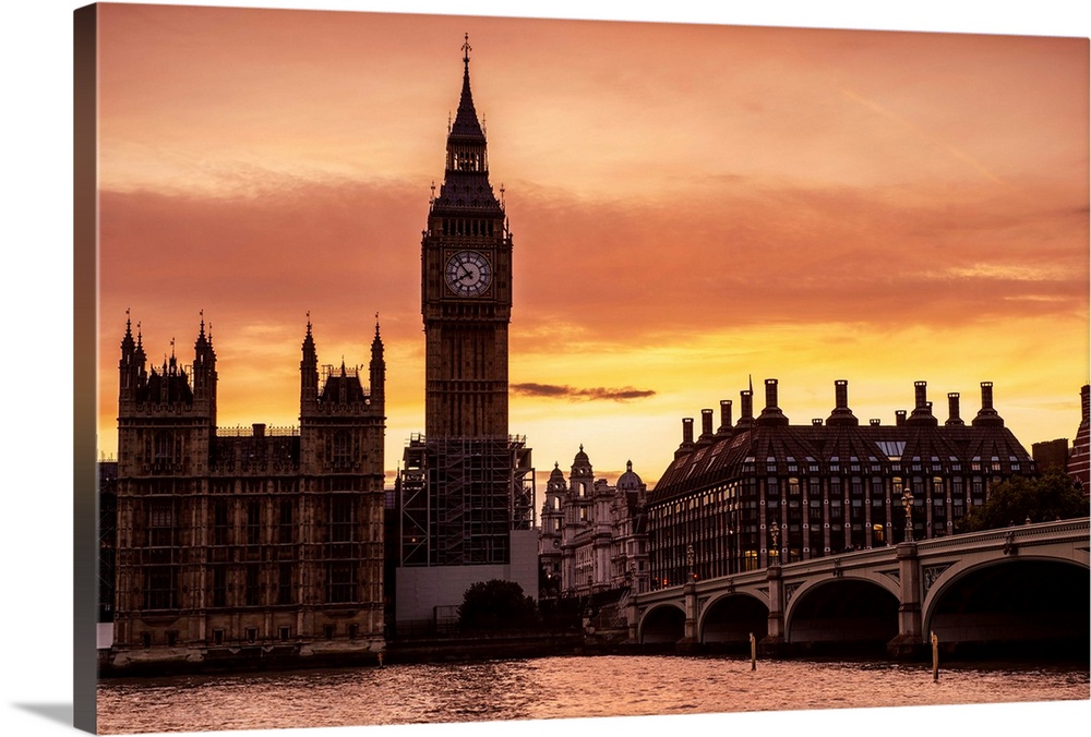 View of Big Ben and Westminster Bridge at sunset in London, England.