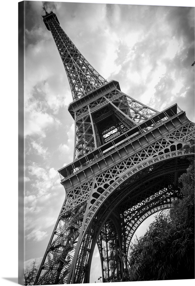 Black and white photograph of he Eiffel Tower from a unique angle.