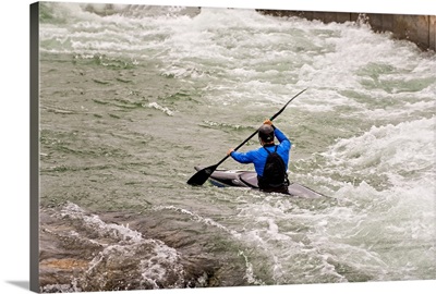 Blue Kayaker paddling through Whitewater Rapids - IV