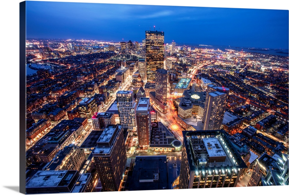 Photo of Boston cityscape at night featuring the John Hancock Tower.