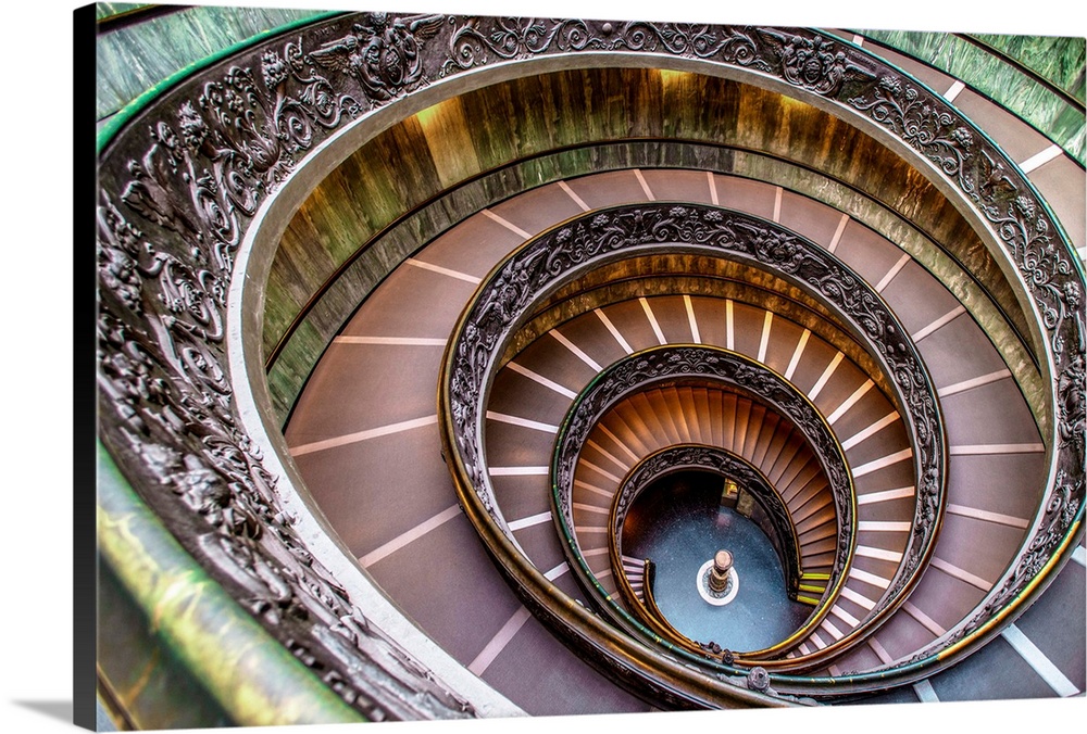 View of the famous spiral of Bramante Staircase, built in 1932 located in the Vatican Museum, Italy.