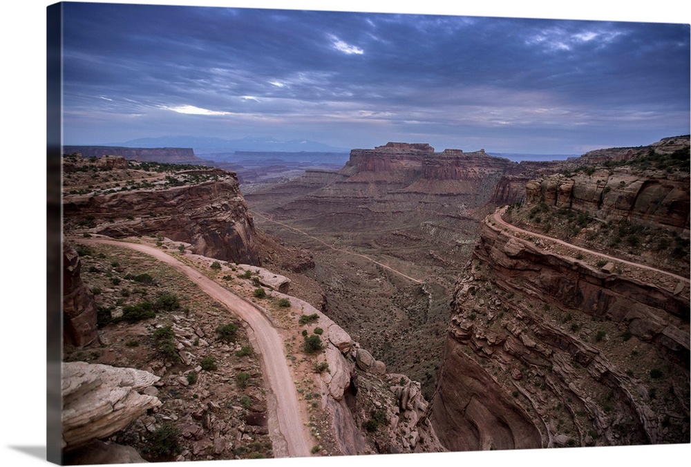 Landscape photograph of a view at Canyonlands National Park with a dark blue sky.