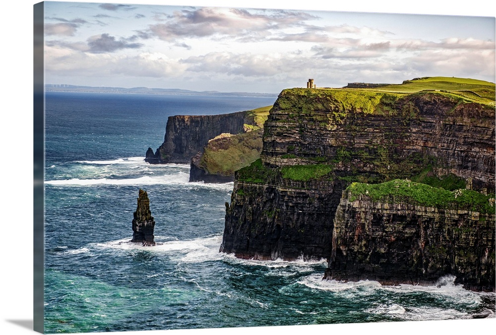 Photograph of the Cliffs of Moher with O'Brien's Tower seen in the distance, marking the highest point of the Cliffs of Mo...