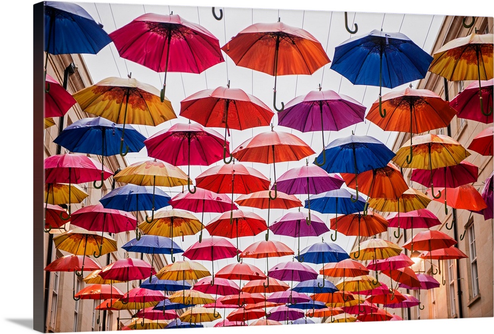 Horizontal photograph of the colorful umbrellas hanging in Southgate Shopping Centre in Bath, England, UK.
