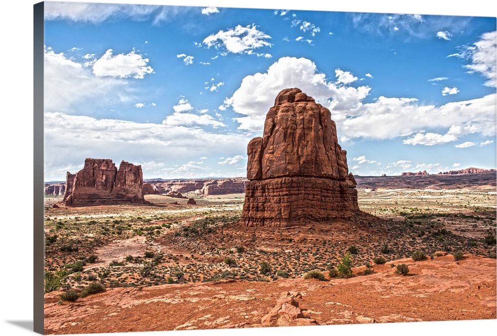 Sandstone formations, the Courthouse Towers, in the desert landscape of Arches National Park, Utah.