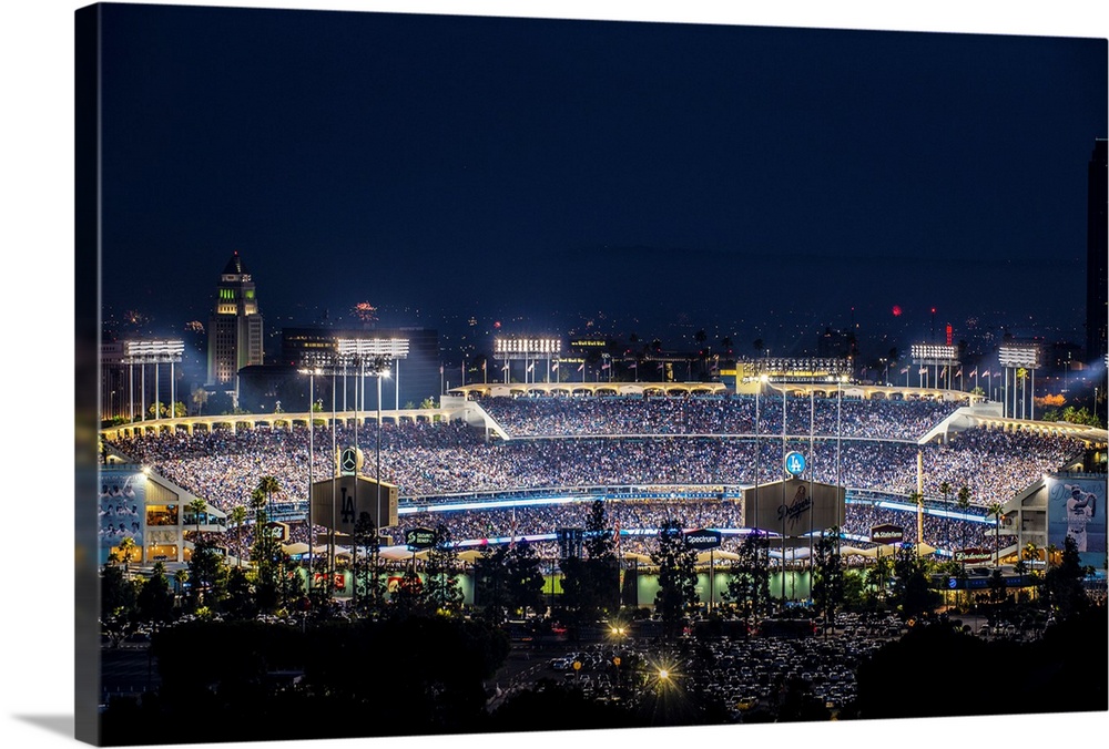 Photograph of Dodger Stadium lit up on a game night.