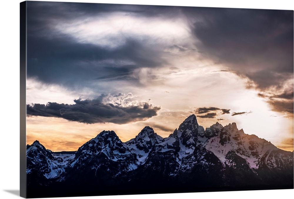 View of dramatic clouds over Teton mountains in Wyoming.