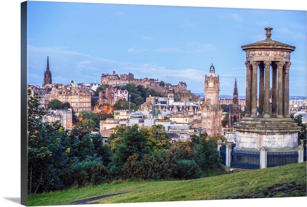 View of Edinburgh and Dugald Stewart Monument on top of Calton Hill in Scotland. The Dugald Stewart Monument is a memorial...