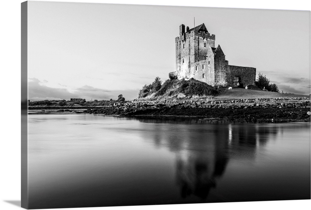 Black and White landscape photograph of the Dunguaire Castle reflecting into the water on the southeastern shore of Galway...