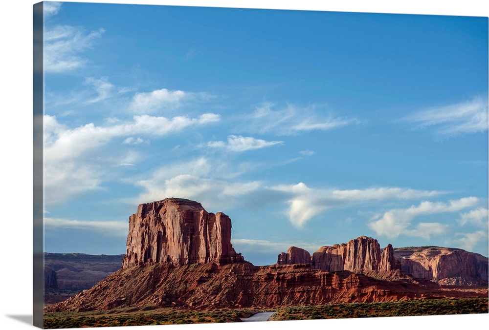 Blue skies hover over Elephant Butte in Monument Valley, Arizona.