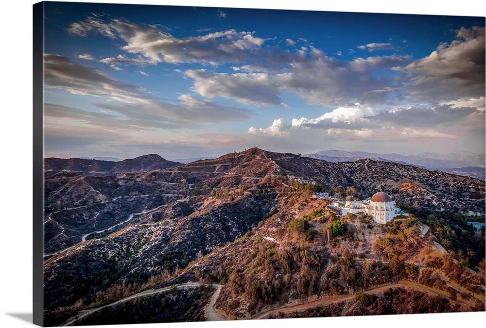 Aerial view of the Griffith Observatory on the hills outside of Los Angeles, California, at sunset.