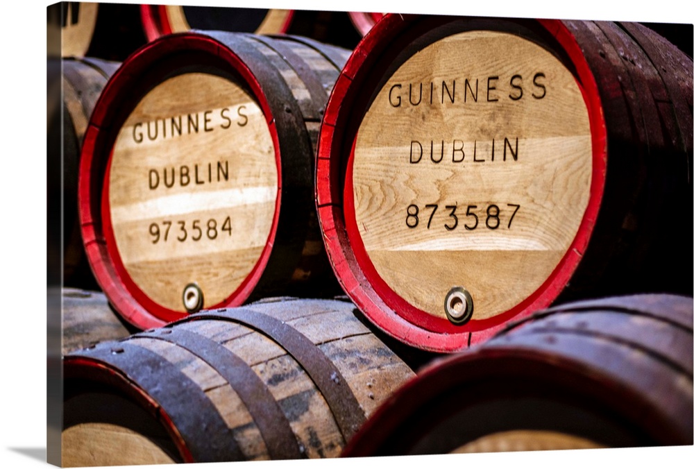 Close-up photograph of Guinness beer barrels on display at the Guinness Storehouse in Dublin, Ireland.