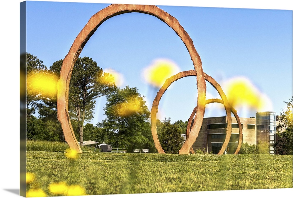 Gyre, made of three concrete and steel rings by Thomas Sayre, is a sculpture in the Ann and Jim Goodnight Museum Park at t...