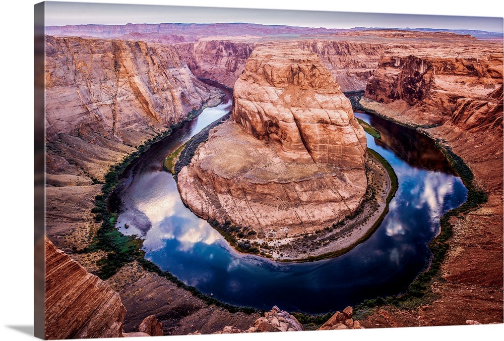 Landscape photograph of Horseshoe Bend in Arizona with the blue and green Colorado River reflecting the sky above and cont...