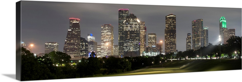 Panoramic photograph of the Houston TX skyline at night from Eleanor Tinsley Park.