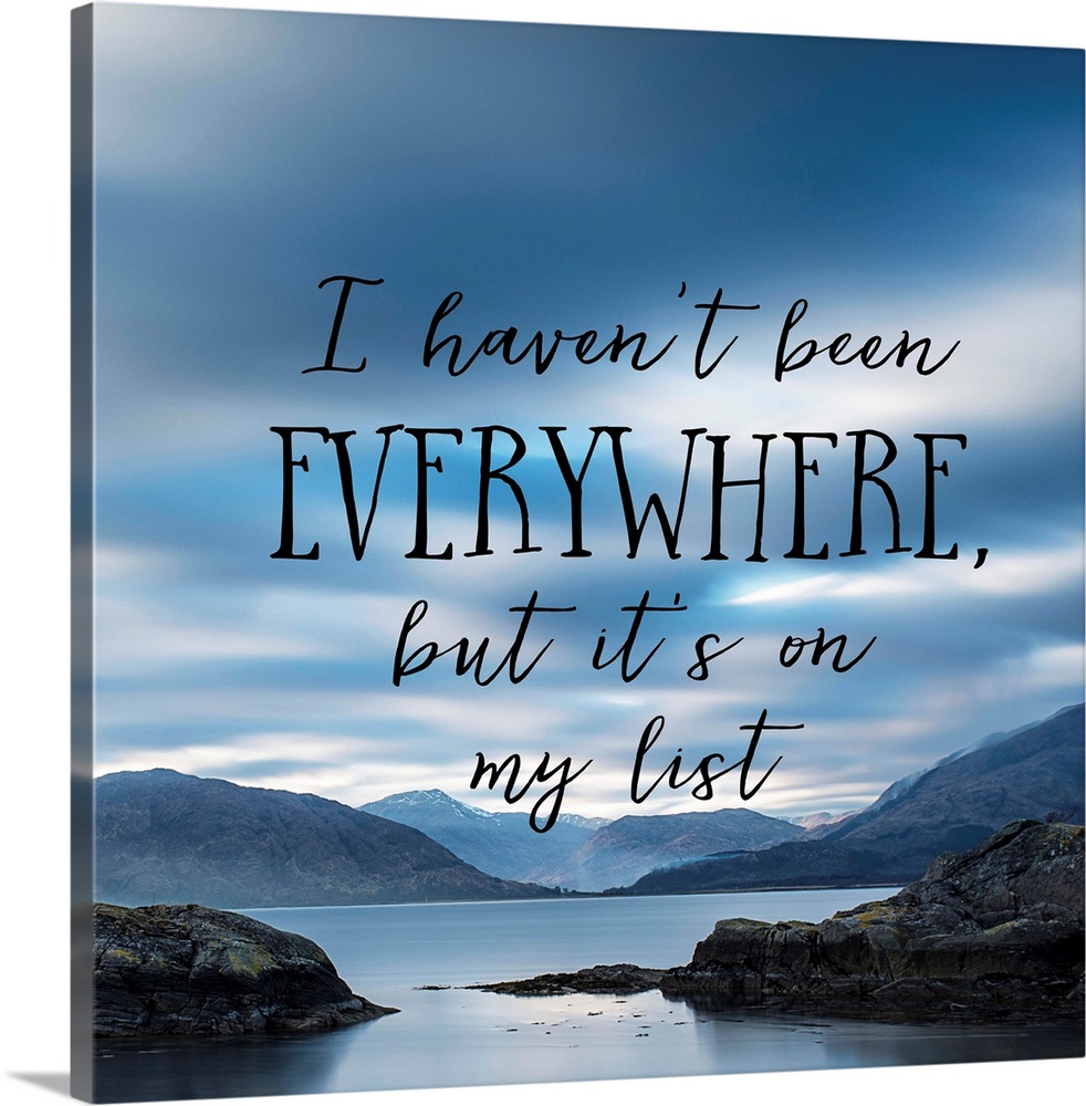 Black text reading "I haven't been everywhere, but it's on my list" over an image of a misty bay with an overcast sky.