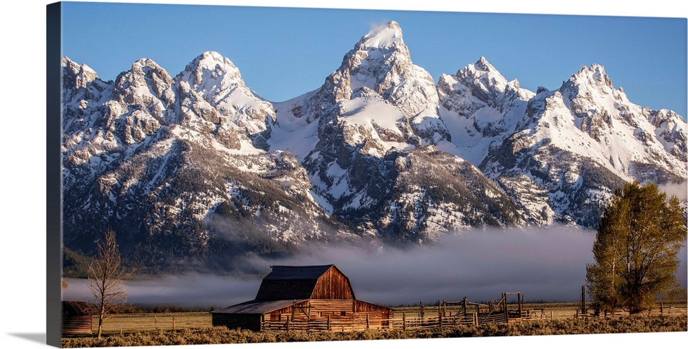 View of the John Moulton Barn with Middle Teton, Grand Teton and Mount Owen in the background. Grand Teton National Park, ...