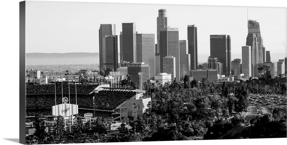 Photograph of the downtown Los Angeles skyline with Dodger Stadium on the left.
