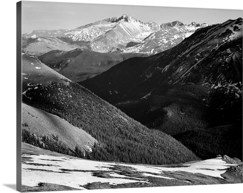 Long's Peak, Rocky Mountain National Park, close in panorama, dark shadowed hills in foreground, mountains in background.