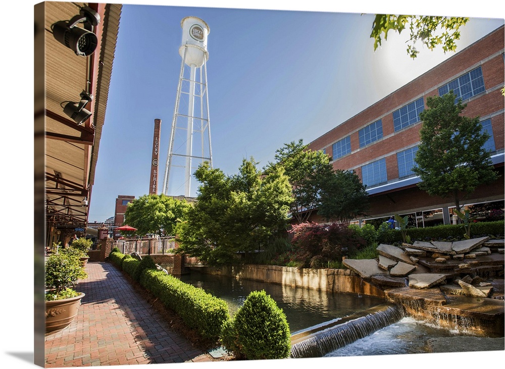 Lucky Strike Water Tower and Smokestack over a water feature running through the redeveloped American Tobacco Historic Dis...