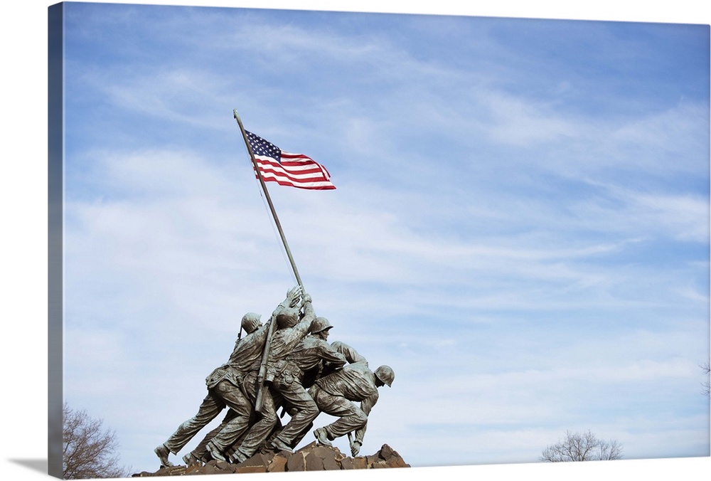 The Iwo Jima Memorial Statue against a blue sky in Washington, DC.