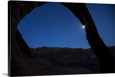 Moon behind the Corona Arch at Night, Arches National Park, Utah