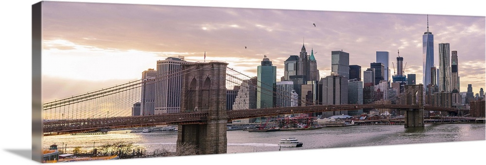 The Brooklyn Bridge and New York City Skyline, New York, seen in the morning.