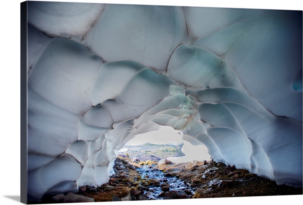 Glacier caves are often carved out by water running through or under the glacier's ice.