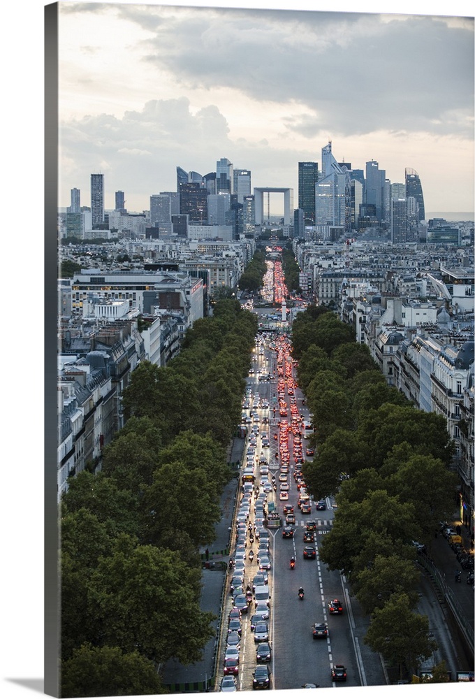 Aerial photograph of the Paris skyline at rush hour.