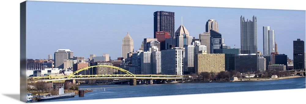 Skyline of Pittsburgh, Pennsylvania, with the Fort Pitt Bridge leading into the city.