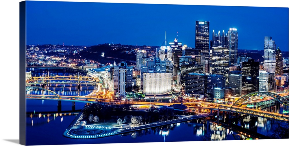 Photo of downtown Pittsburgh at night with Point State park.